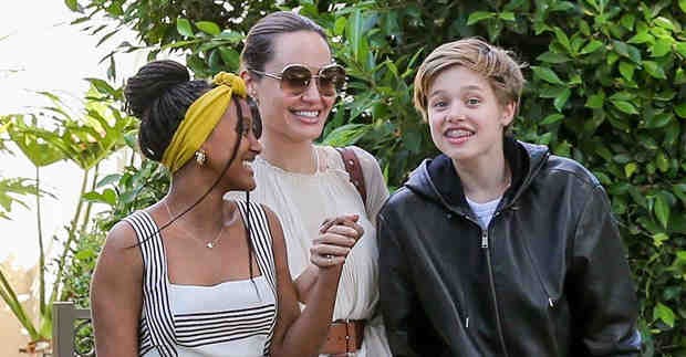 Teenage Shiloh Jolie Pitt Wears Black Overall Shorts with Mom Angelina and Siblings