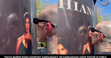Travis Barker Kisses Kourtney Kardashian's The Kardashians Show Poster in Public
