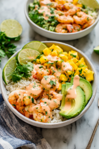 Drizzle with the lime-chili sauce and garnish with fresh cilantro and lime wedges